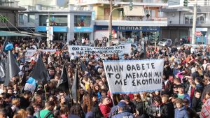 people gathered in the streets in a rally
